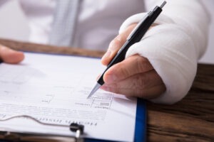 person wearing a cast filling out a SSD form