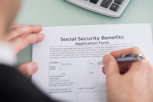 man-filling-out-SSD-benefits-form