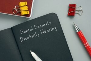 social-security-disability-hearing-sign-on-notebook