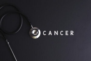 The word cancer and a stethescope