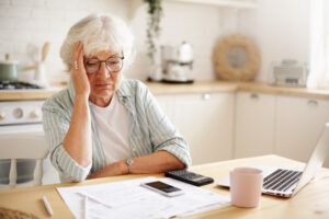 Sad elderly woman stressed about Social Security Disability lost appeal.