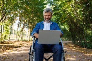 Man in a wheelchair who is learning about the Adult Disability Starter Kit
