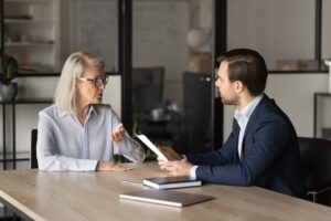 A client talks with an attorney about a dire need letter for a Social Security Disability claim.