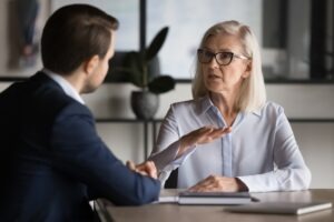 An attorney meets with a woman to explain that she can appeal a Disability Denial at the Spartanburg SSA office.
