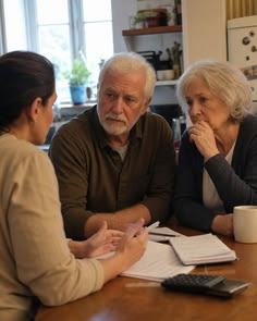 An older couple sits with a lawyer as she explains whether they can get SSDI after 55 in 2026 with no computer skills.